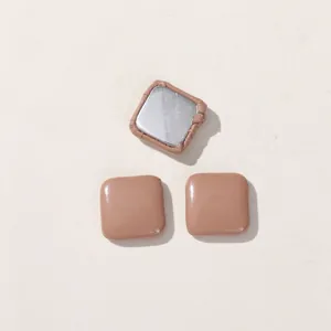 Detail of square DIY decorative buttons in milk tea brown for crafts and hair accessories