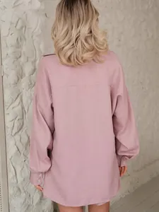 Back view of oversized pink long-sleeve shirt with textured fabric for women