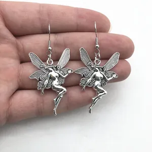 Vintage silver gothic fairy angel wing earrings for Y2K aesthetic jewelry collection.