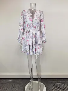 Floral print V-neck mini dress with lantern sleeves and tiered ruffles on a mannequin