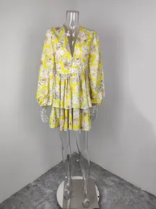 Full length detail of a yellow floral print V-neck mini dress featuring lantern sleeves