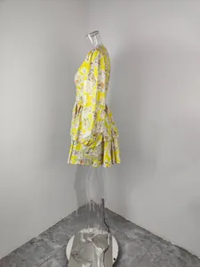 Side view of a vibrant yellow floral print mini dress with elegant lantern sleeves.