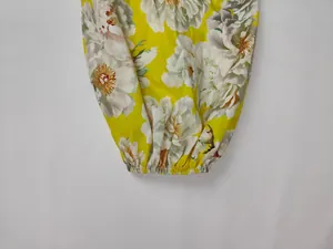 Close-up detail of elastic lantern sleeve cuff on floral print spring dress for women.