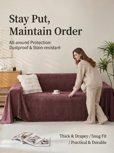 A female model arranging a high-quality purple chenille sofa throw on a couch in a living room.