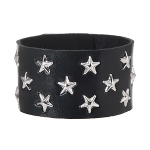 Close-up detail of punk rock style black leather bracelet with silver star rivets