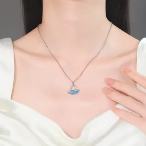 Elegant heart necklace with blue wave rhinestone pendant on a silver-tone chain.