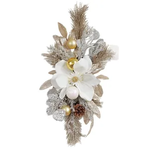 Elegant Christmas magnolia wreath featuring gold balls and pinecones for festive door decor.