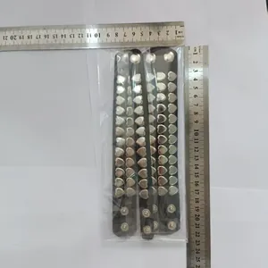 Detailed view of three punk heart rivet bracelets with rulers showing exact size
