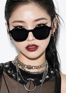 Close-up of stylish retro black polygonal sunglasses worn by an Asian female model