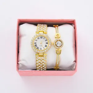 Elegante set di orologio e bracciale dorati decorati con strass lucidi e numeri romani