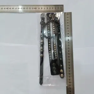 Set of 4 punk leather bracelets with rivets and stars, shown with measurement scale.