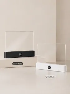 Close-up of black and white flat panel LED reading lamps with digital display base