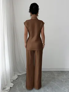 Back view of elegant brown two-piece set featuring sleeveless shirt and straight pants