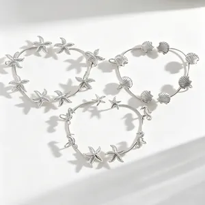 Eleganti ear cuff argento a tema marino con stella marina, conchiglia e ippocampo