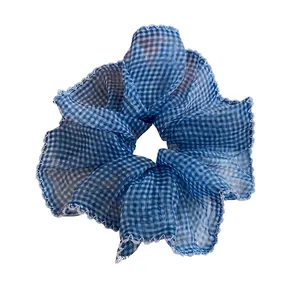 Stylish blue and white checkered mesh scrunchie hair tie for elegant bun hairstyles