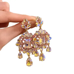 Luxurious vintage palace style gold earrings with sparkling iridescent floral crystals for banquet