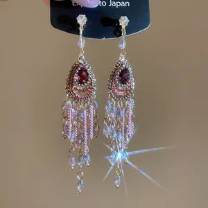 Boucles d'oreilles bohèmes vintage dorées avec pierres rouges et perles de cristal