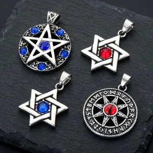 Close-up detail of titanium steel pendants with mystical runes and star designs