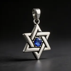 Close-up detail of vintage Star of David pendant with blue gemstone in titanium steel.