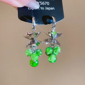 Elegant silver flower tassel earrings featuring vibrant green crystal beads for women