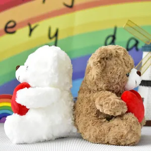 Adorabili orsetti di peluche bianchi e marroni con cuori rossi per bambini