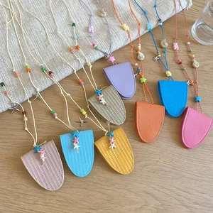 Macro detail showing variety of colorful dopamine leather neck necklaces with starfish charms