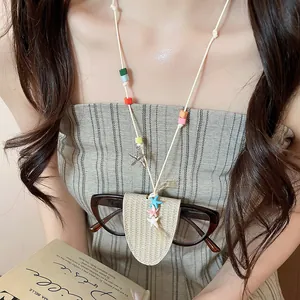 Close-up of sweet vacation style leather neck glasses holder with colorful charms