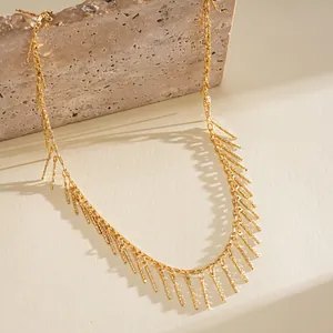 Vintage gold fringe necklace with textured copper rod tassels and elegant chain detail