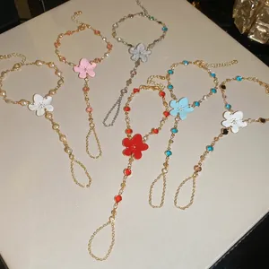 Elegantes pulseras anillo con flores de metal esmaltado en varios colores y estilos