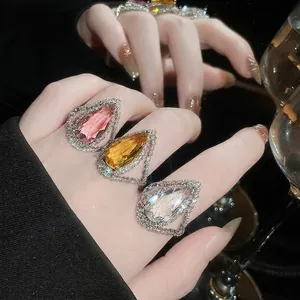 Sparkling teardrop crystal rings with full halo diamond setting for cocktail parties