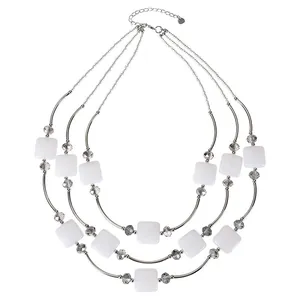 Elegant three-layer layered necklace featuring white square beads and grey crystal accents