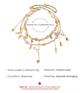 Detailed view of a layered beach-style waist chain with imitation pearls and seashells