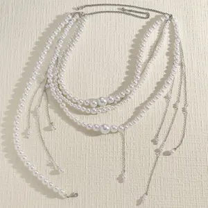 Elegant multilayer white pearl waist chain featuring silver tassels for dress accessories