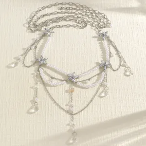 Elegant multi-layer pearl waist chain with silver flower charms and crystal pendants