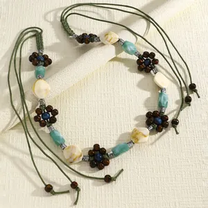 Bohemian waist chain with green cords, wooden flower beads and marble patterned stones