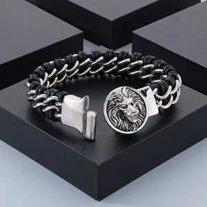 Close-up of masculine men's stainless steel lion head bracelet with black braided leather