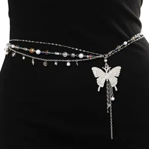 Elegant layered pearl waist chain featuring a sparkling butterfly pendant with long tassels