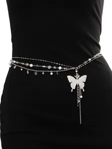 Detailed view of silver-tone multi-layer waist chain with butterfly pendant and pearls