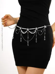 Elegant multi-layer pearl waist chain with crystal tassels shown on a black dress