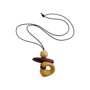 Bohemian ethnic style necklace with wooden bead and geometric resin pendant on black cord