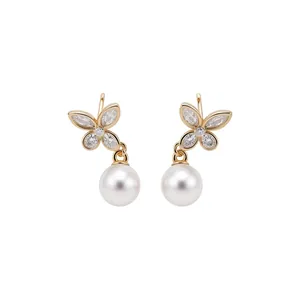 Elegant gold butterfly drop earrings featuring zircon wings and round white pearls