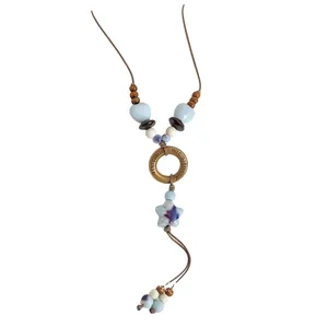 Vintage ethnic ceramic bead necklace featuring bronze ring and star pendant charm