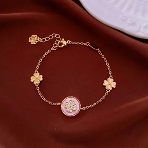 Élégant bracelet fleurs en zircon plaqué or 18 carats avec médaillon rose et trèfles