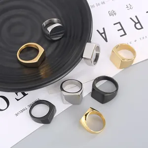 Minimalist stainless steel signet rings in gold, silver, and black polished finishes