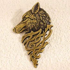 Detailed view of vintage wolf head brooch with antique bronze finish for men's suits