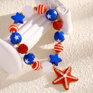 Detailed view of Independence Day beaded bracelet with rhinestone starfish pendant