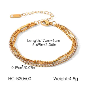 Detailed close-up of a three-layer gold stainless steel bracelet with sparkling zirconia