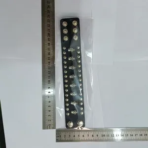 Measurement of punk style wide leather bracelet with silver skull and rivet studs