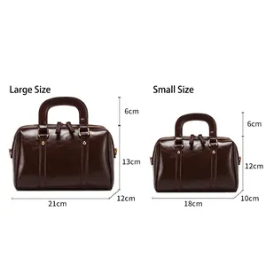 Size comparison of retro brown Boston handbags with precise dimensions shown