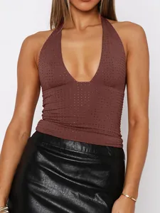 Detailed macro shot of a brown Y2K deep V-neck halter top with rhinestone dots